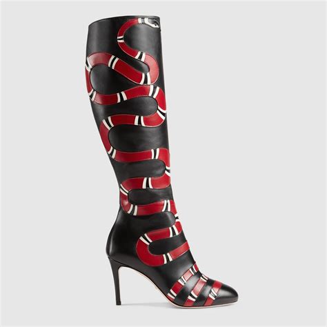 gucci boots with snakes on the bottom|Gucci delma snake effect boots.